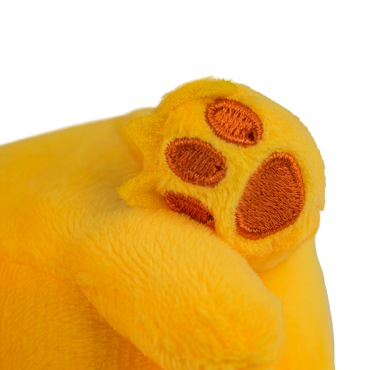 Close-up Of A Yellow Plush Toy Paw With Brown Pads