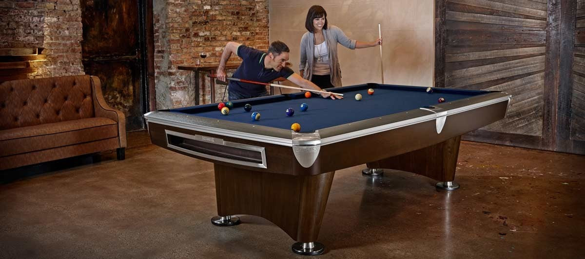 People Playing At A Brunswick Gold Crown VI Skyline Walnut Pool Table