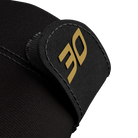 Close-up of black glove fabric with black glove lock featuring gold 30 branding